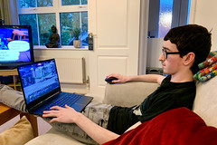 Gaming downstairs with his parents