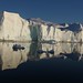 An iceberg calves off of Jakobshavn Glacier