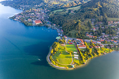Aerial view of the Tegernsee lake in Bavaria with the town of Tegernsee, the Abbey and a large green area
