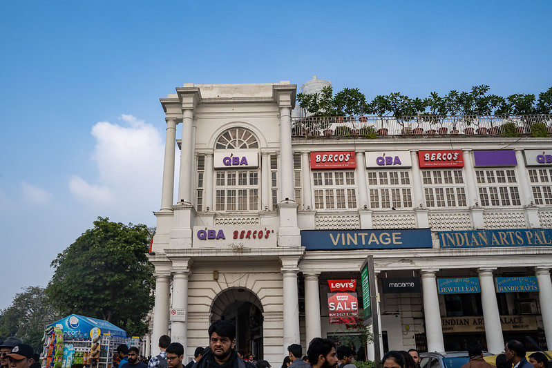 New Delhi, India - December 15, 2019:   Connaught Place, a shopping and restaurant complex with Western stores and entertainment<br/>© <a href="https://flickr.com/people/39908901@N06" target="_blank" rel="nofollow">39908901@N06</a> (<a href="https://flickr.com/photo.gne?id=50429384532" target="_blank" rel="nofollow">Flickr</a>)