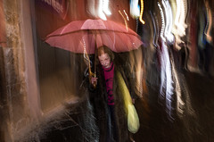 Elderly woman with umbrella