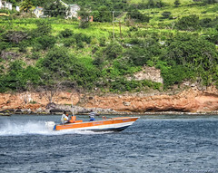 A Speedboat cruises the New Guinea Coastline, St. Kitts