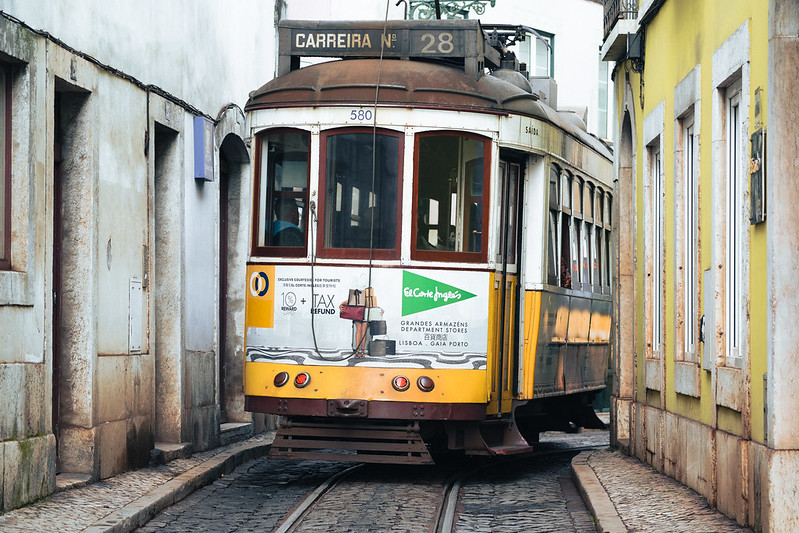 Lisbon, Portugal - January 17, 2020: Famous tram cable car 28 makes its way up the narrow cobblestone streets of Lisbon<br/>© <a href="https://flickr.com/people/39908901@N06" target="_blank" rel="nofollow">39908901@N06</a> (<a href="https://flickr.com/photo.gne?id=50670388462" target="_blank" rel="nofollow">Flickr</a>)