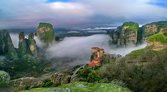 St.Barbara (Rousanou) Meteora monastery in mist panorama UNESCO world heritage