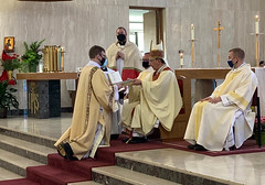 Deacon Nicholas Fratus receives the Book of the Gospels.
