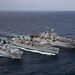USS Iwo Jima (LHD 7), right, USNS Supply (T-AOE 6) and the Royal Navy landing platform dock ship HMS Albion (L 14) conduct a replenishment-at-sea.