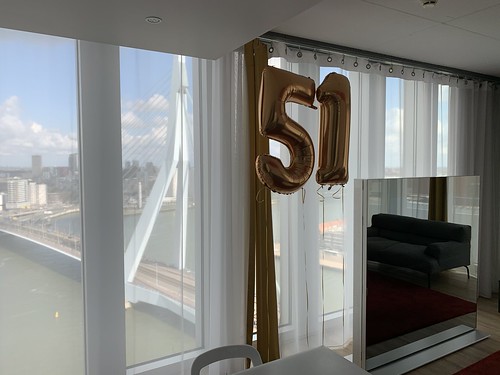 Foilballoon Number 51 Birthday with view on the Erasmusbrug Rem Koolhaas Suite NHOW Hotel Rotterdam