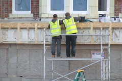 Yellow jacketed couple repairing a Blackpool hotel