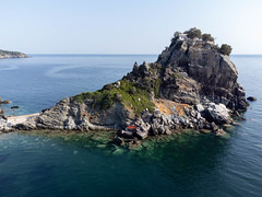 Agios Ioannis chapel and monastery surrounded by the sea on the northern side of Skopelos, Greece