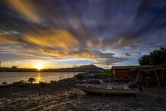 Houseboat at Low Tide During Sunset