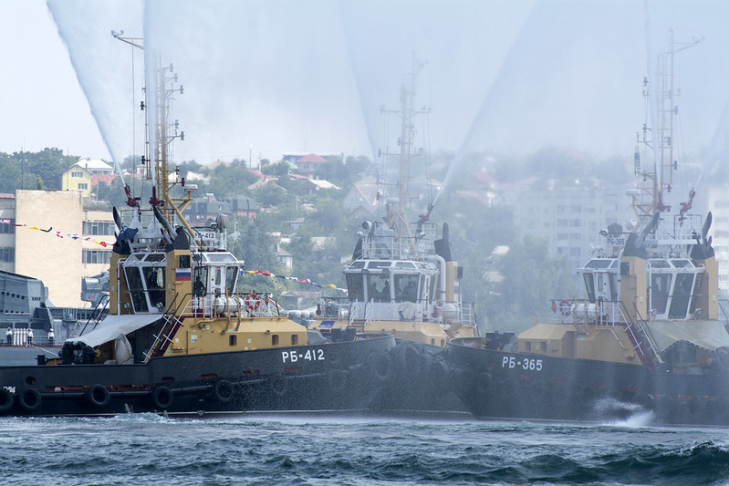 Three tugs dance "Waltz of fountains" in the aquatorium of the Sevastopol bay in the day of fleet of Russia.<br/>© <a href="https://flickr.com/people/192122096@N08" target="_blank" rel="nofollow">192122096@N08</a> (<a href="https://flickr.com/photo.gne?id=51488425072" target="_blank" rel="nofollow">Flickr</a>)