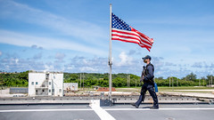 A Sailor stands watch aboard USS Charleston (LCS 18) in Guam.