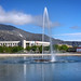 Fountain in the center of Kirovsk city with Khibiny mountains in the background, Russia, June 2019