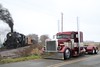 Steam and Diesel.  A local trucker posed his Peterbilt just south of Burnett