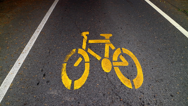 Vibrant Bright Yellow Bike Lane Sign<br/>© <a href="https://flickr.com/people/32512570@N06" target="_blank" rel="nofollow">32512570@N06</a> (<a href="https://flickr.com/photo.gne?id=51776524429" target="_blank" rel="nofollow">Flickr</a>)