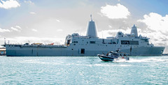 U.S. Navy Maritime Expeditionary Security Squadron (MSRON) 10 provides security to USS Portland (LPD 27) during a sustainment and logistics visit to the Port of Djibouti.