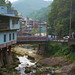 Vertical Landscape of Creek Running Through Mountain Town in Taiwan