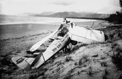 Tiger Moth VH-ARF crashed on the beach at Port Douglas, 1955