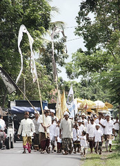 Balinese Hindu procession on the main street at Nusa Penida, Bali