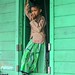 A boy standing in front of his house, Jantur East Borneo