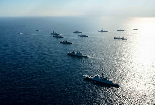 Standing NATO Maritime Group 2 ships and submarines sail in formation in the Ionian Sea off the coast of Sicily.