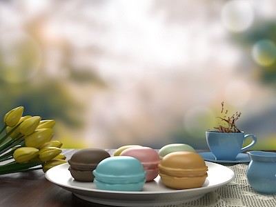 Macaroons with tea and flowers