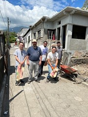 Chandler Villanueva, Fr. Michael Kesicki, Zachary Lentz, Alejandro (mission volunteer), and Michael Scanga take a break from a construction project.