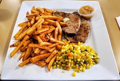 Pork chops; applesauce; corn/peas/carrots; French fries