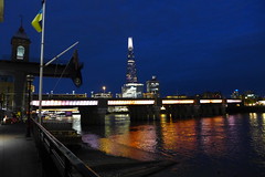 Night has fallen, and as we leave the Little Ship Club, the lights of London add a certain mysterious elegance to the river, to Canon Street Bridge, and to the Shard. (photo by Roger Johnson)