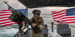 Boatswain’s Mate 1st Class Jordan Massey provides security for ships inside the Port of Djibouti.