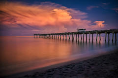 Long exposure of storm clouds at sunrise over the Venice Fishing Pier, Venice, Florida