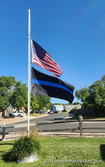 September 12, 2022 - Flags at half staff for Arvada police officer Dillon Vakoff. (ThorntonWeather.com)
