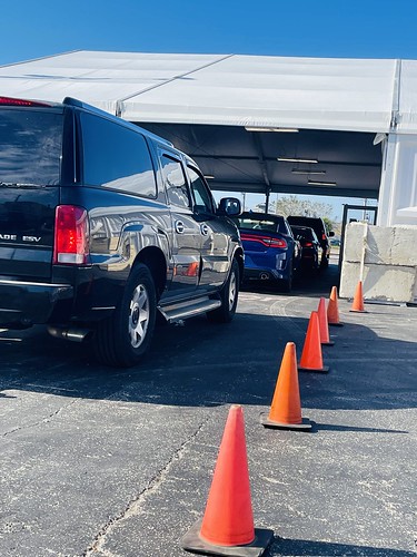 Customers with vehicles damaged from Ian line up at the State Farm auto claims drive through customer center at 4200 Tamiami Trail in Port Charlotte. Appointments available for streamlined service.