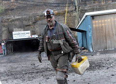 a-miner-walks-at-the-end-of-his-shift-in-an-underground-mine-in-the-gateway-eagle-mine-an-united-mine-workers-mine-in-pond-fork-boone-county-in-southern-west-virgini