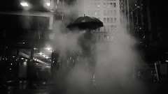 a man walking through steam