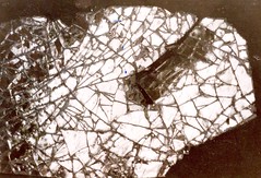 Abstract (systematic) photography the amazing pattern of a smashed rearview mirror on a car-park in the urban city the beauty of cracked glass pic image