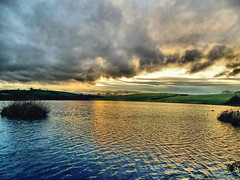 IN EXPLORE 09/01/2023 THE SUN HAS GONE AND STRANGE DARK CLOUDS OVER KERNAN LAKE GILFORD NORTHERN IRELAND