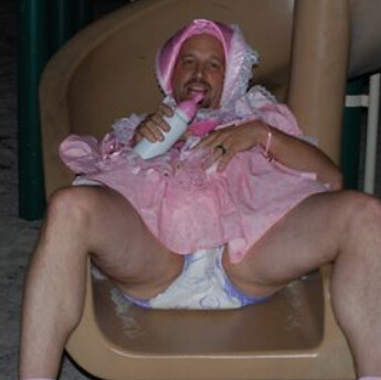 Pink binki baby girl in bows and frilly diapers
