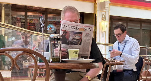 Man reading the Las Vegas Sun newspaper