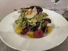 Beet and citrus salad with chicory, roasted shallots, roasted pecans, tres leches manchego, and sherry vinaigrette