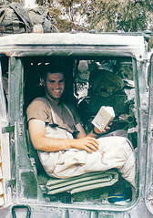 army lieutenant reading in humvee in southern iraq 2003