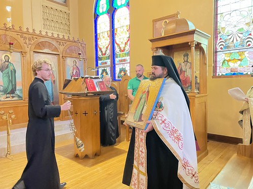 Blessing and placing the icon of Prophet Elias. Fr. Christodulos Margellos and Taylor Rupp