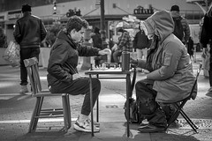 Two people playing chess in Union Square Park, 14th Street, Manhattan, New York City.