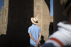 man in hat with light blue polo shirt at kom ombo temple egypt