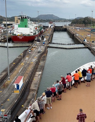 People on the bow as our ship enters the first Miraflores lock