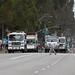 Trash trucks at end of parade