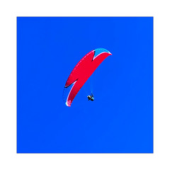 Blue sky & Red Paraglider
