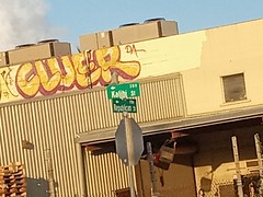 Republican Street and Kalihi Street signs - with a Yellow Graffiti - lower Kalihi Valley Nimitz Hwy