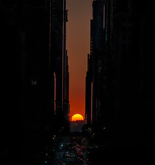 The sun sets at the west end of 42nd Street in Manhattan in an event known as Manhattanhenge.