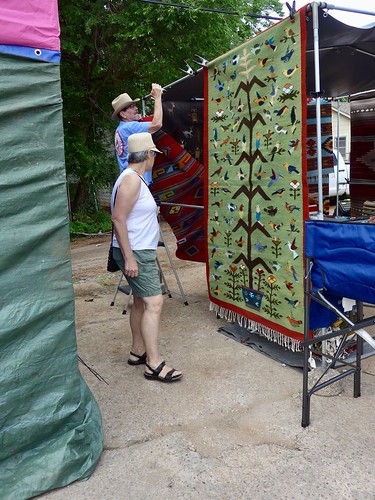 Catherine admires some of the rugs for sale, Paseo Arts Festival